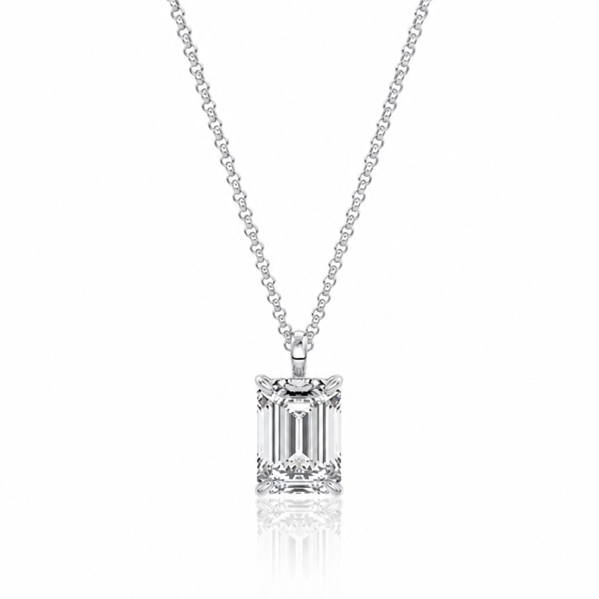 Diamond necklace with emerald-cut pendant on a white background