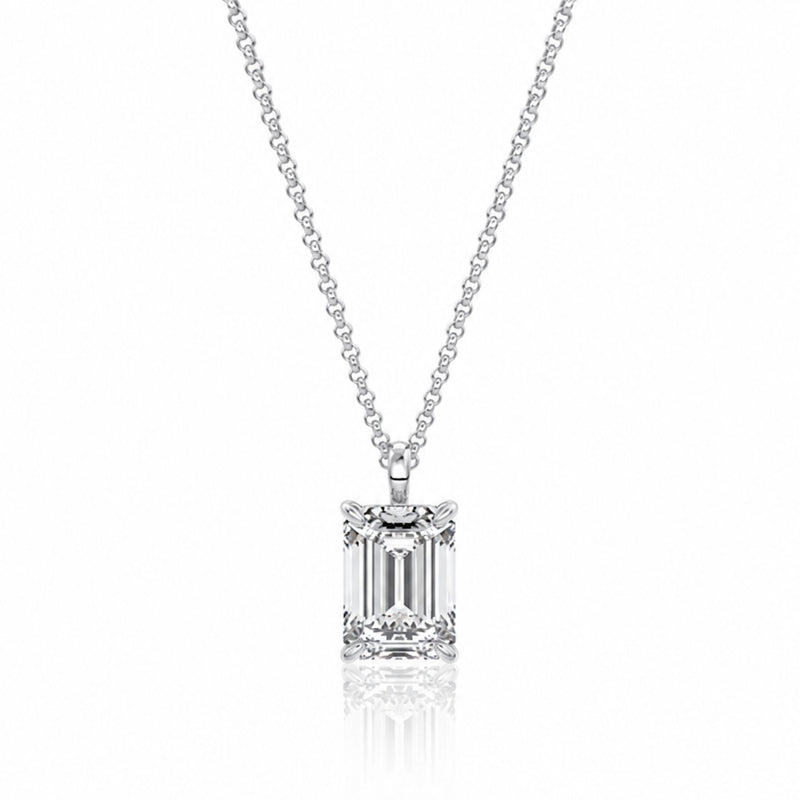 Diamond necklace with emerald-cut pendant on a white background